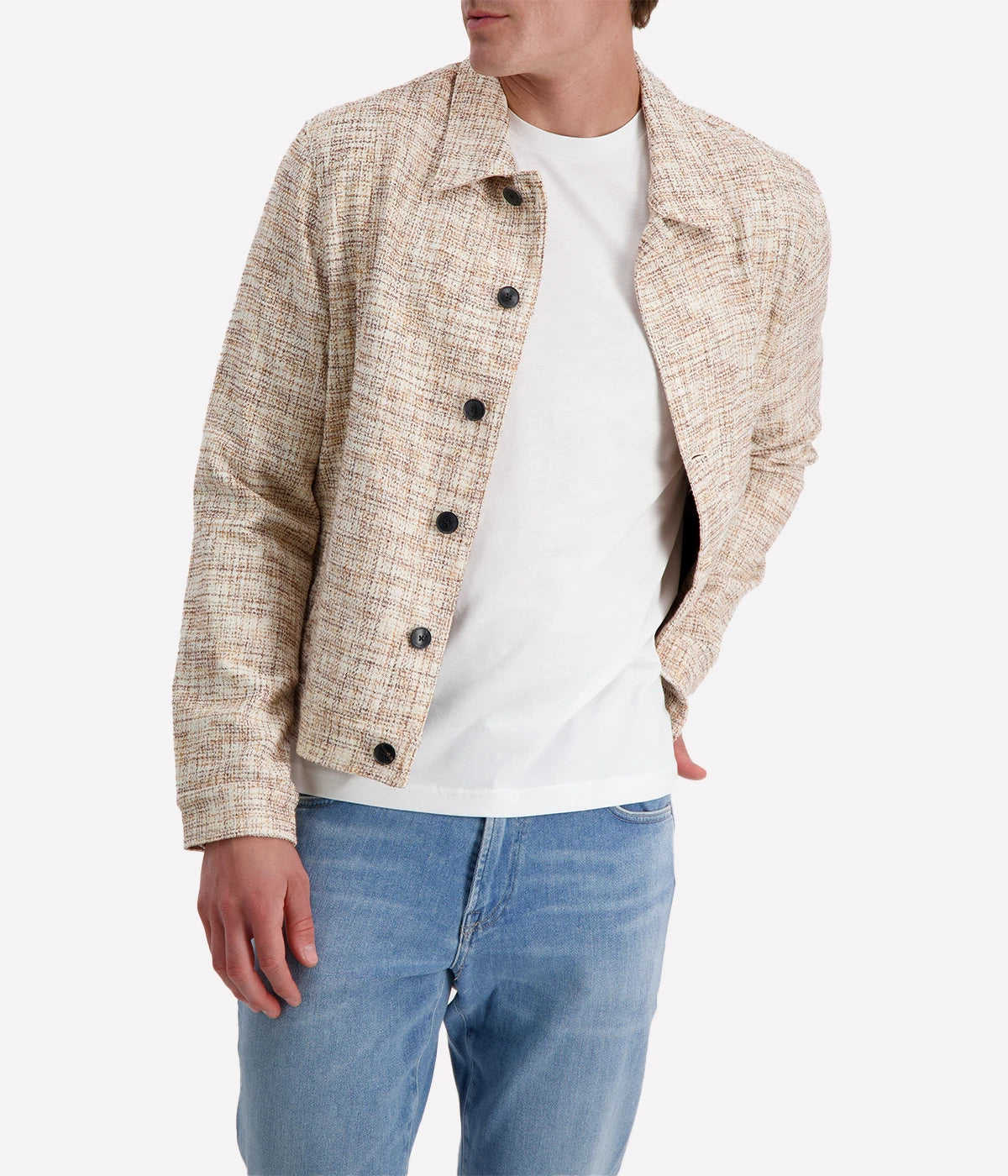 John Varvatos cream and brown textured trucker jacket with black buttons, worn over a white T-shirt and blue jeans for a modern casual look.