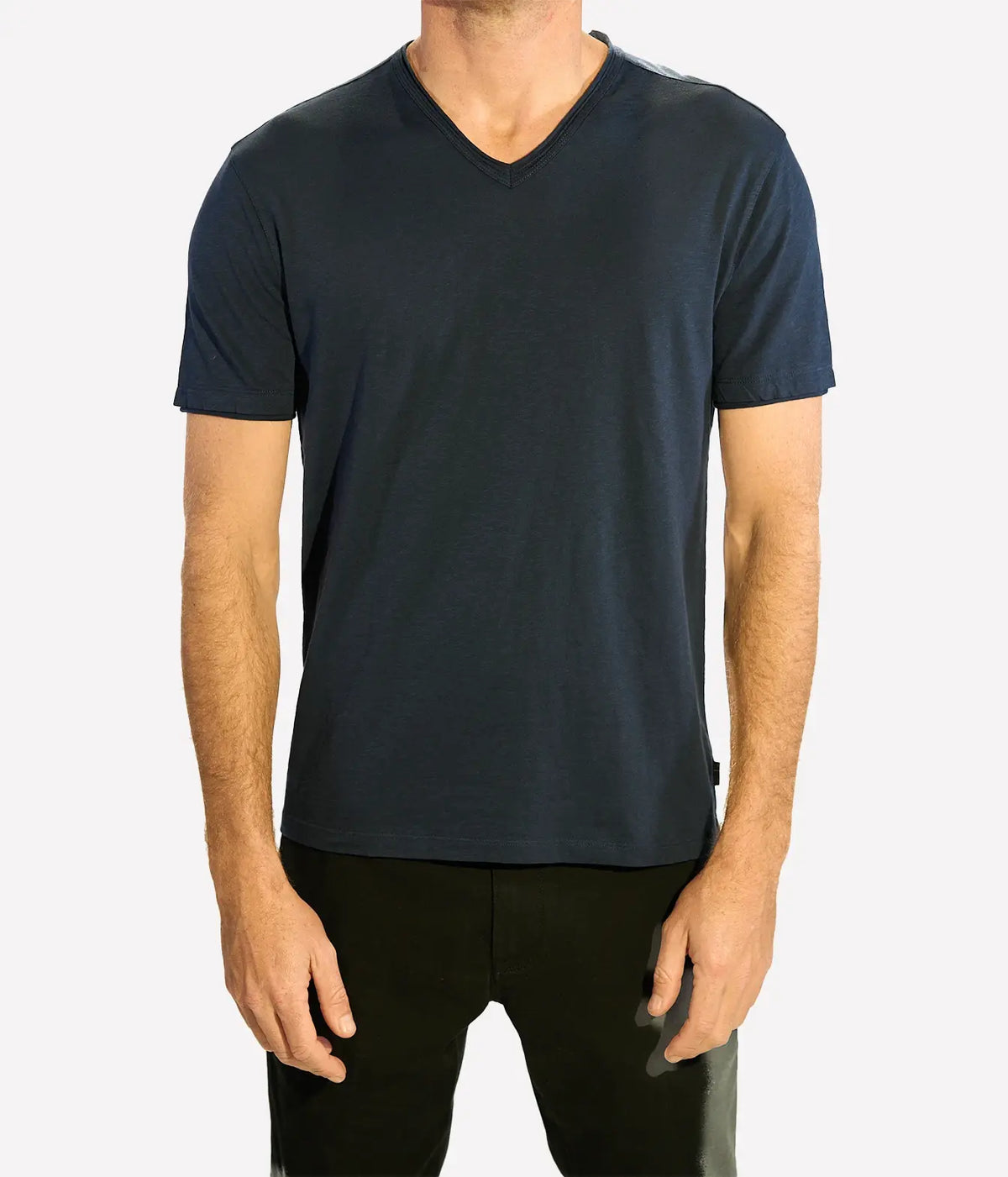 Man wearing John Varvatos Miles Raw Edge V-Neck Tee in Midnight with black trousers, front view