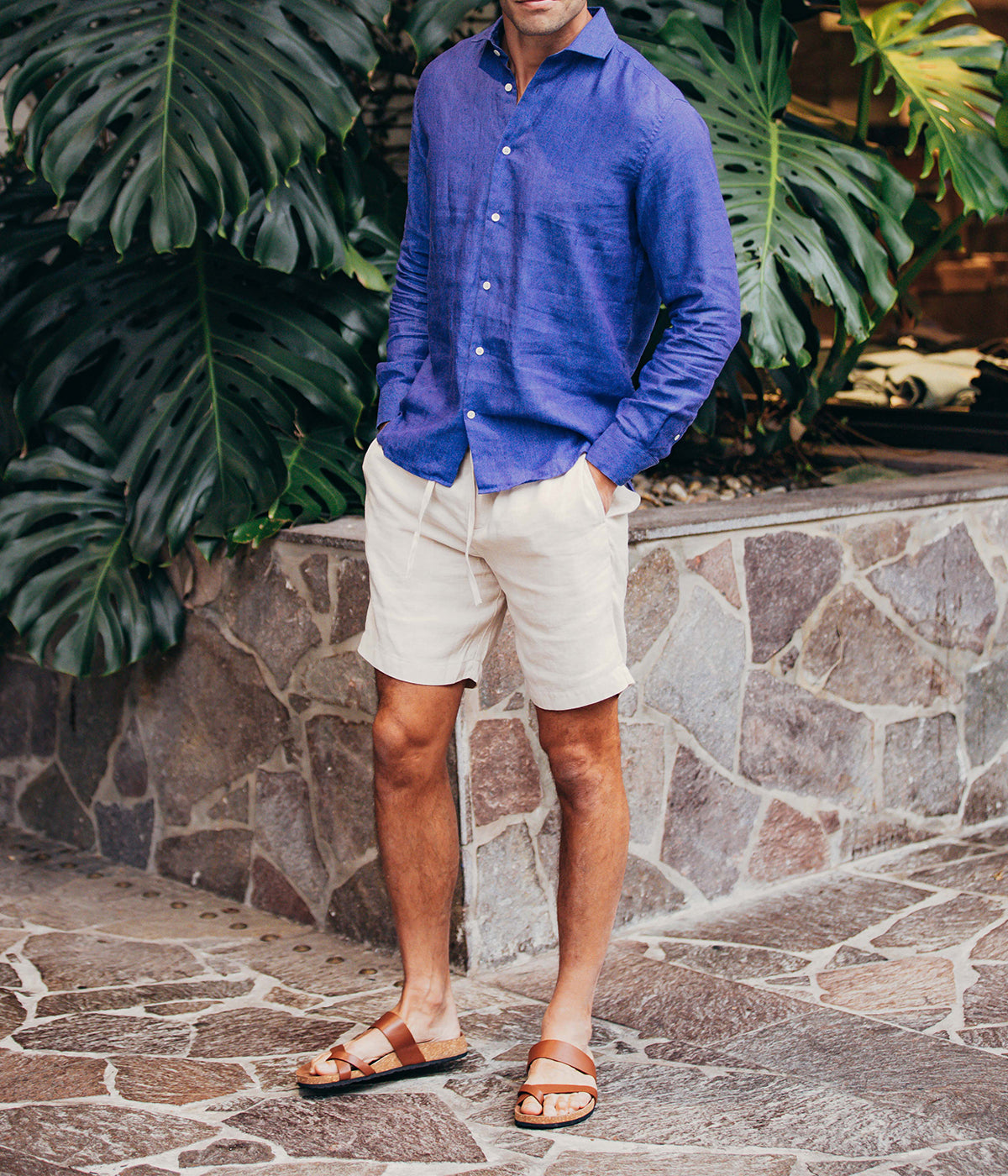 Model wearing the Antonio Long Sleeve Linen Shirt by Frescobol Carioca, showcasing the refined tailoring and premium 100% Italian linen fabric. The structured dress collar, long sleeves, and imitation mother of pearl buttons make this shirt a sophisticated choice for formal or relaxed occasions.