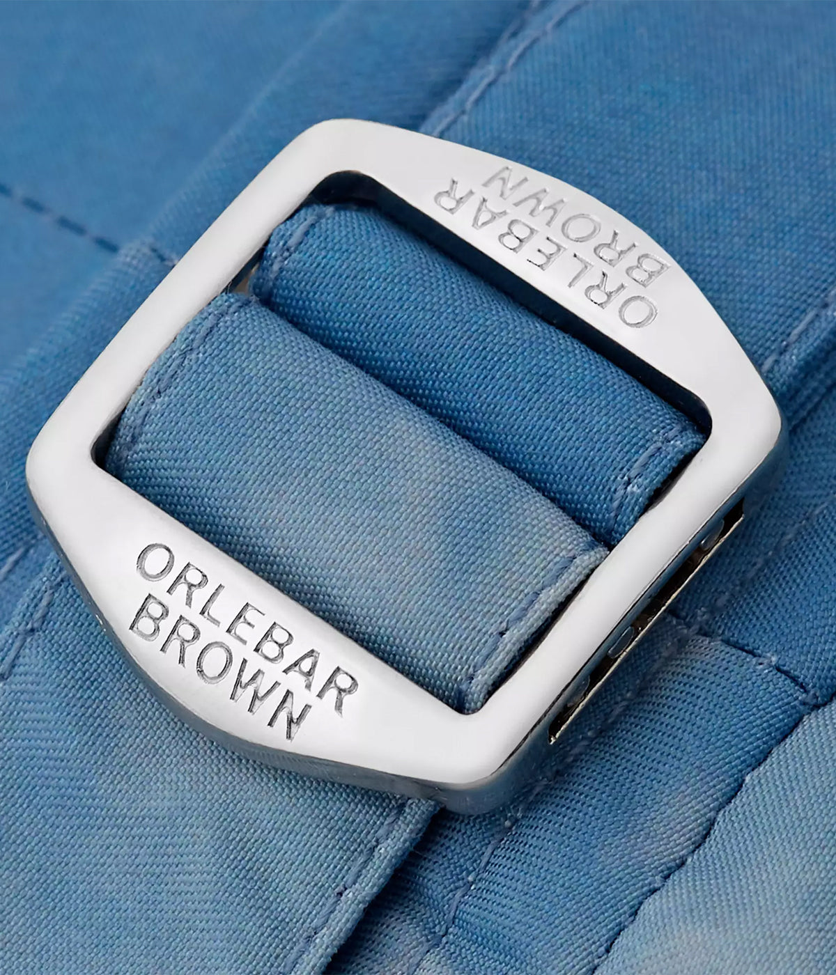 Close-up of the branded side fasteners and tailored waistband on the Orlebar Brown Bulldog Swim Shorts, offering a secure fit and luxury detail.