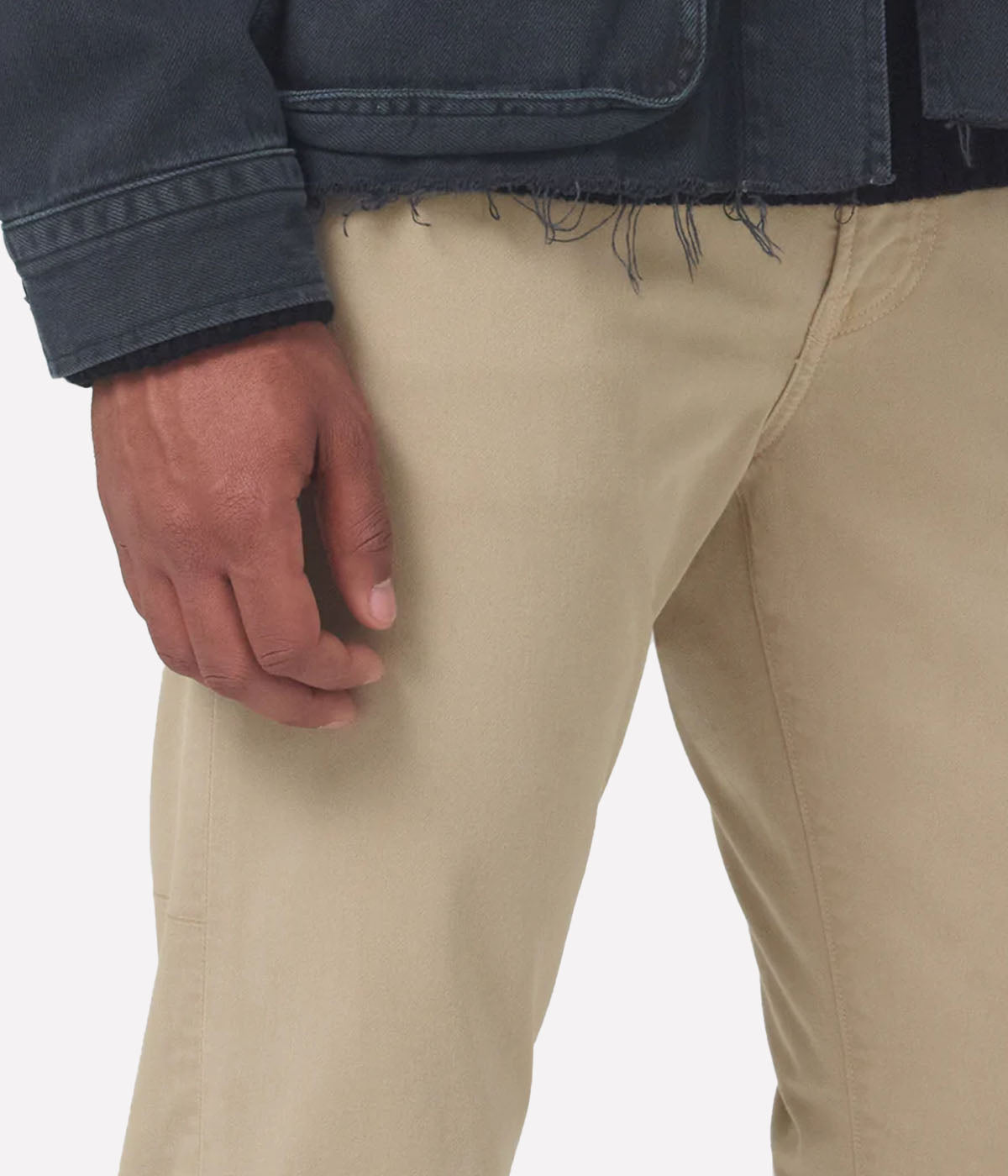 Close-up of the Perform denim texture, tonal stitching, and waistband, emphasising the premium craftsmanship.