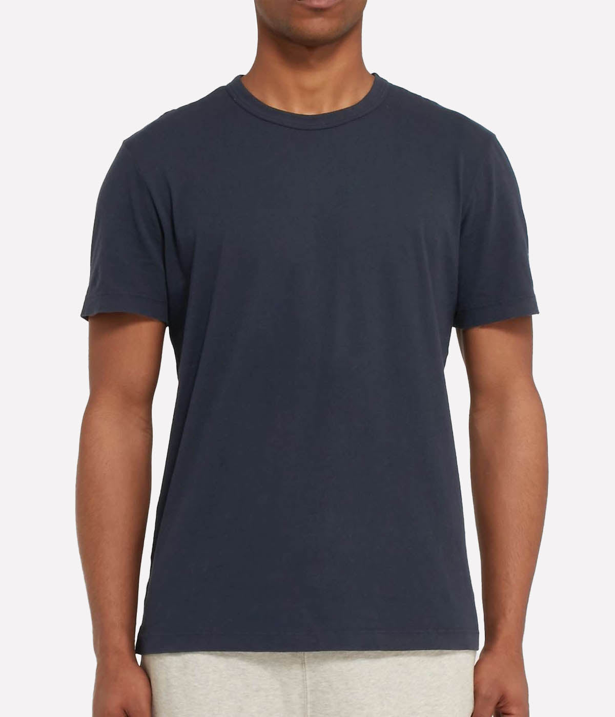 Front view of the James Perse Luxe Lotus Jersey Crew Neck T-Shirt in French Navy, crafted from a luxurious 100% cotton fabric with a smooth, satin-like finish. The shirt features a classic crew neck, short sleeves, and a clean, straight hem for a polished, versatile look.