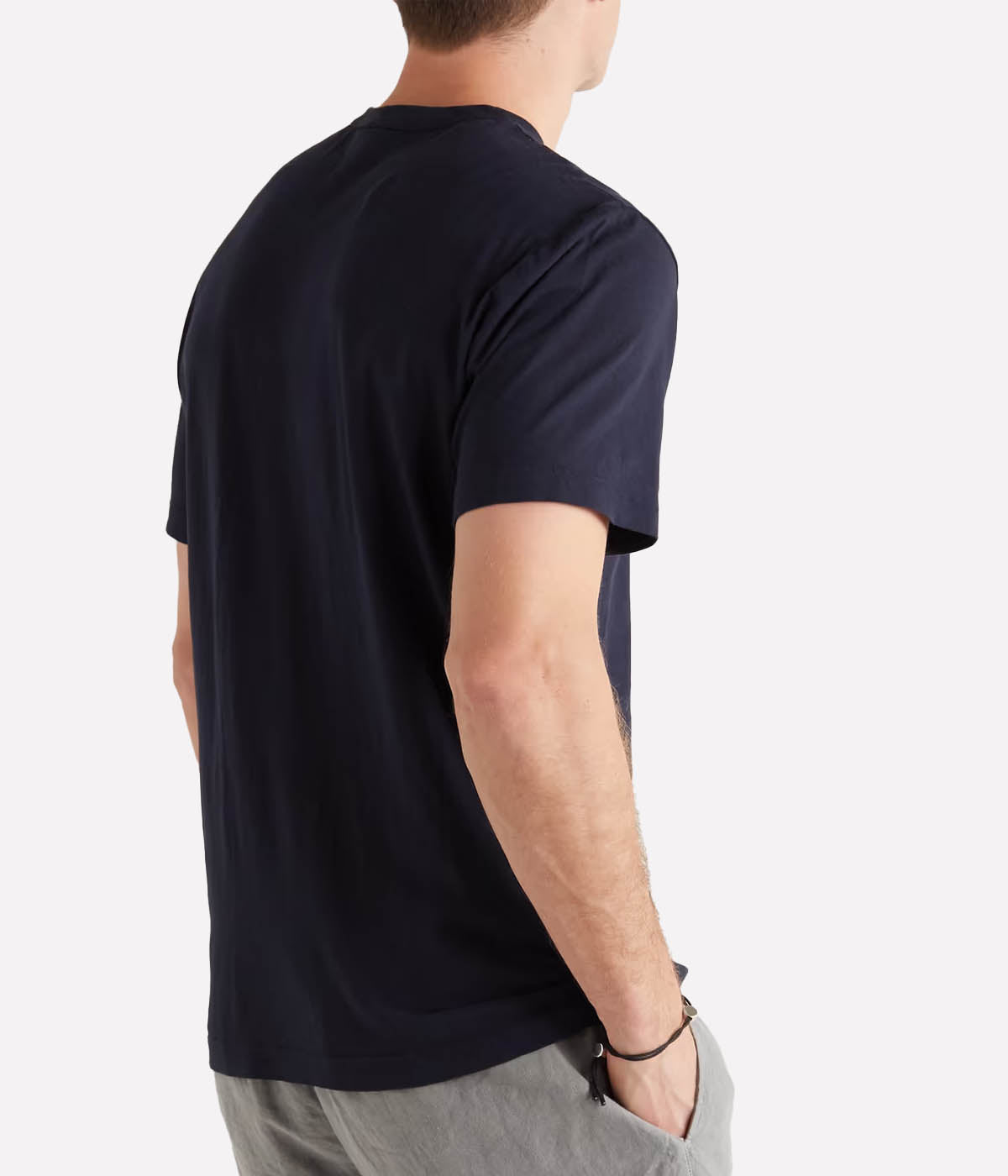 Back view of the James Perse Luxe Lotus Jersey Crew Neck T-Shirt in French Navy, showing the smooth, soft cotton fabric and the clean finished straight hem. The minimal design creates a sleek, modern look suitable for layering or wearing on its own.