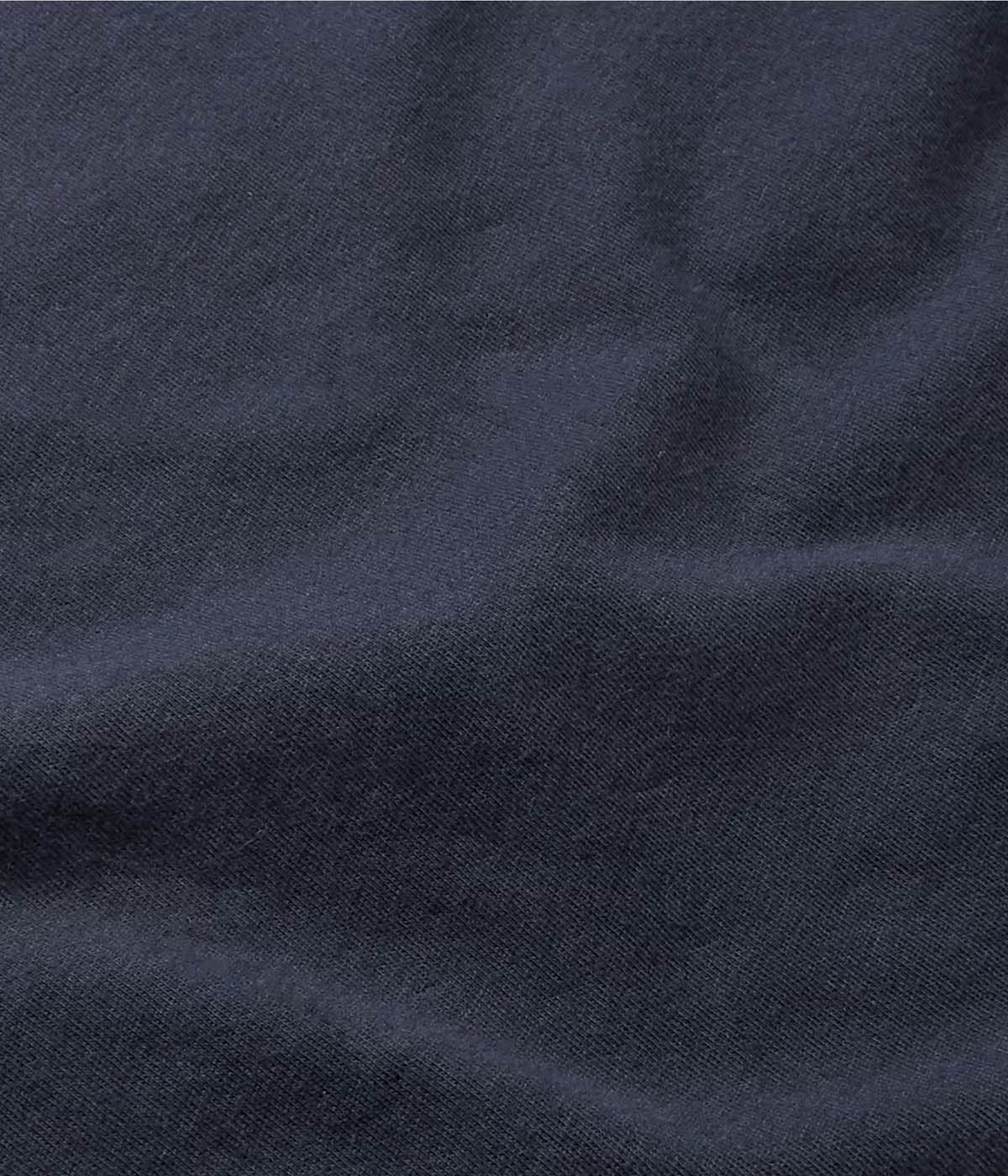 Close-up of the Luxe Lotus Jersey fabric in French Navy, showcasing its ultra-soft, matte satin-like texture. The elevated jersey is crafted in Japan from 100% cotton, offering a luxurious and comfortable feel.