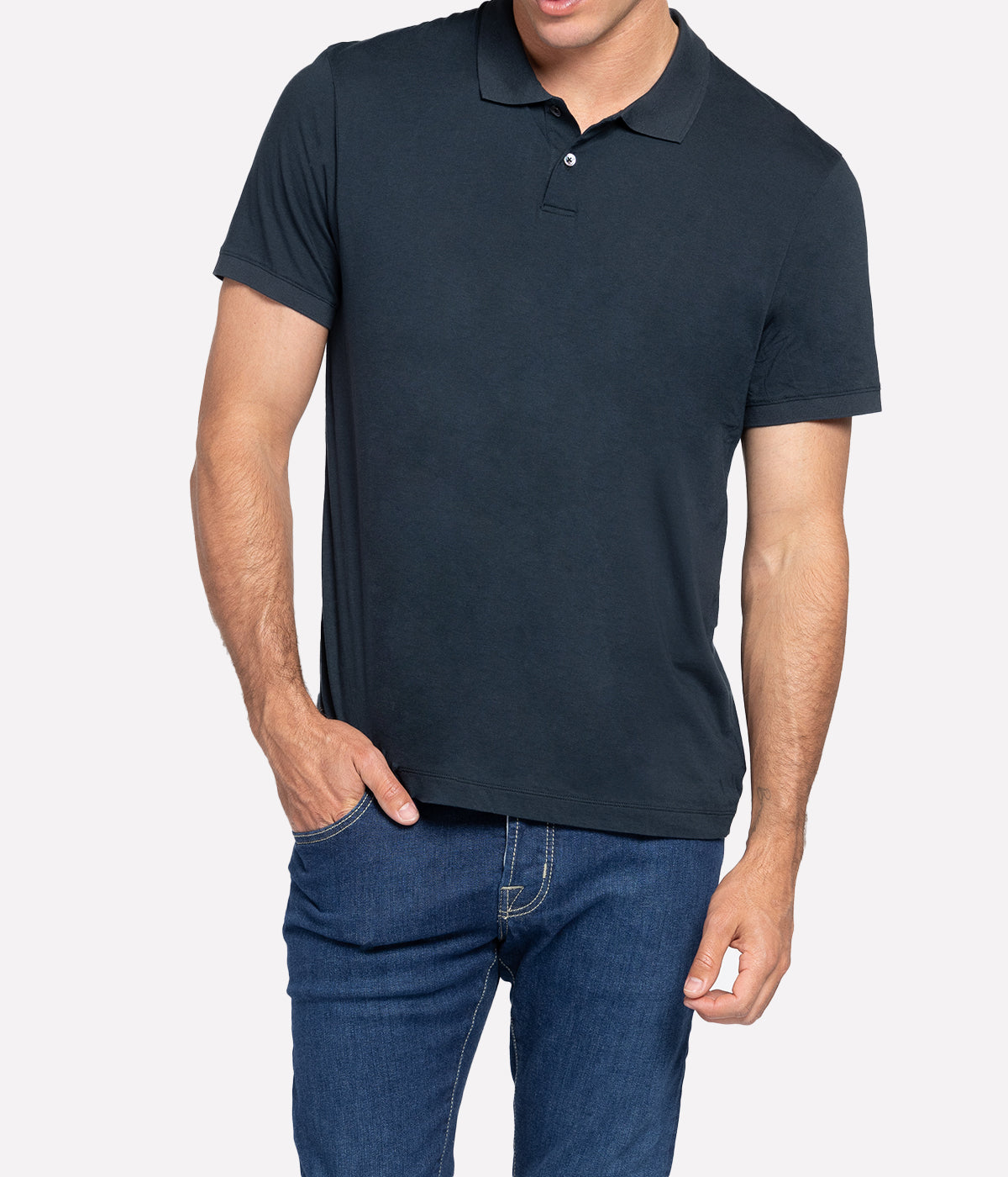 Front view of the James Perse Luxe Lotus Jersey Polo, made from a luxurious 100% cotton fabric with a smooth, satin-like finish. The polo features a classic collar, short sleeves, and a clean, straight hem, offering a refined yet comfortable look suitable for any occasion.