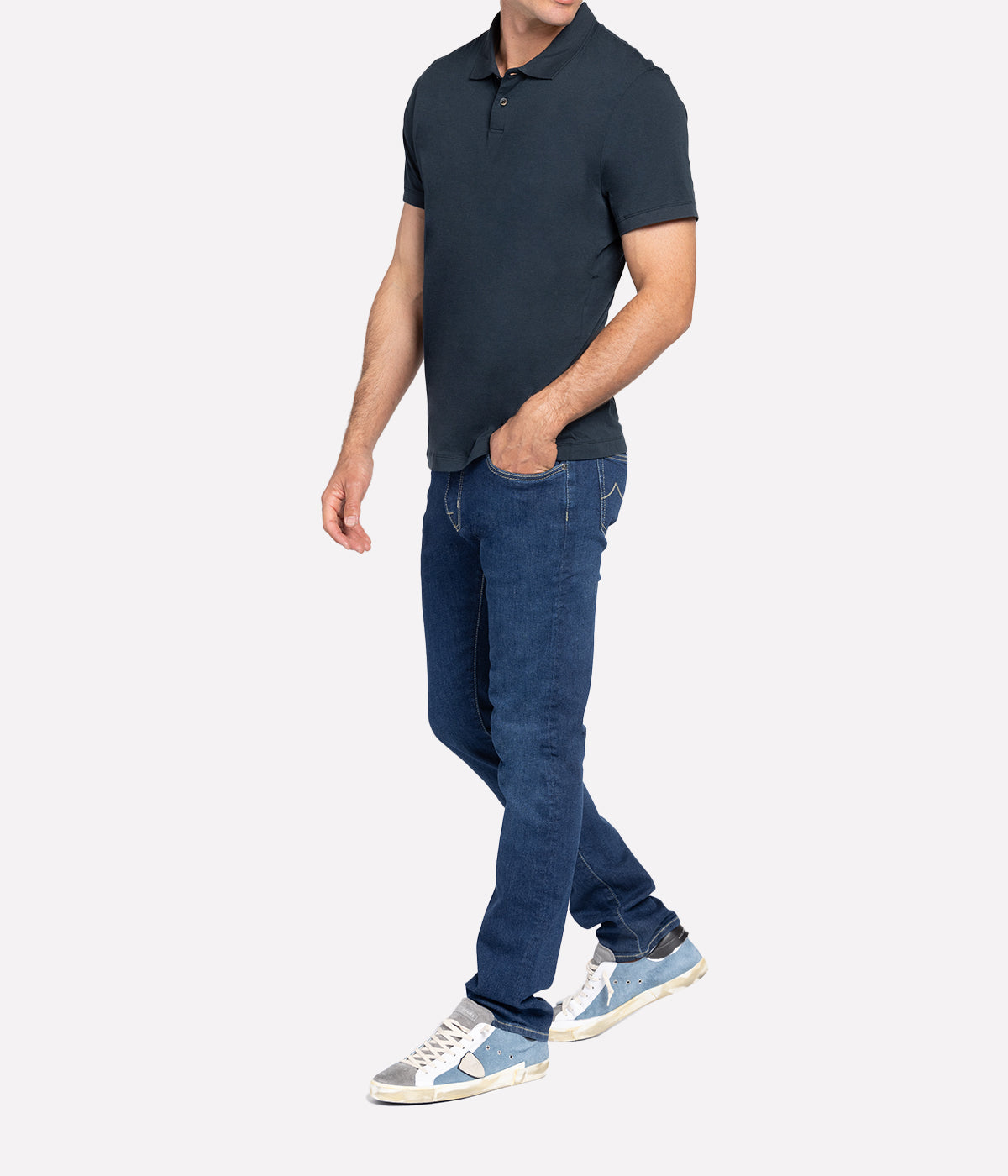 Model wearing the James Perse Luxe Lotus Jersey Polo, showcasing the classic collar, short sleeves, and clean, straight hem. The smooth, elevated jersey fabric drapes effortlessly, offering a polished yet comfortable look perfect for casual or smart styling.