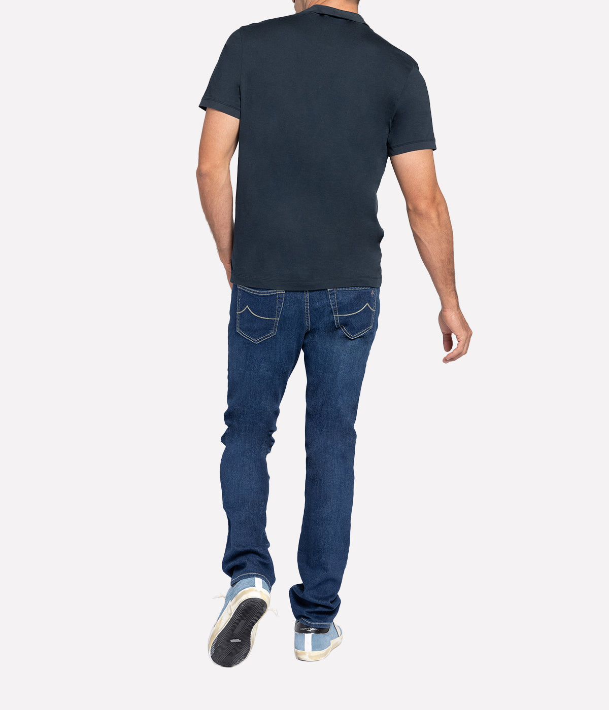 Back view of the James Perse Luxe Lotus Jersey Polo, showcasing the soft cotton fabric and clean finished straight hem. The collar and short sleeves maintain a polished, relaxed look for effortless styling.