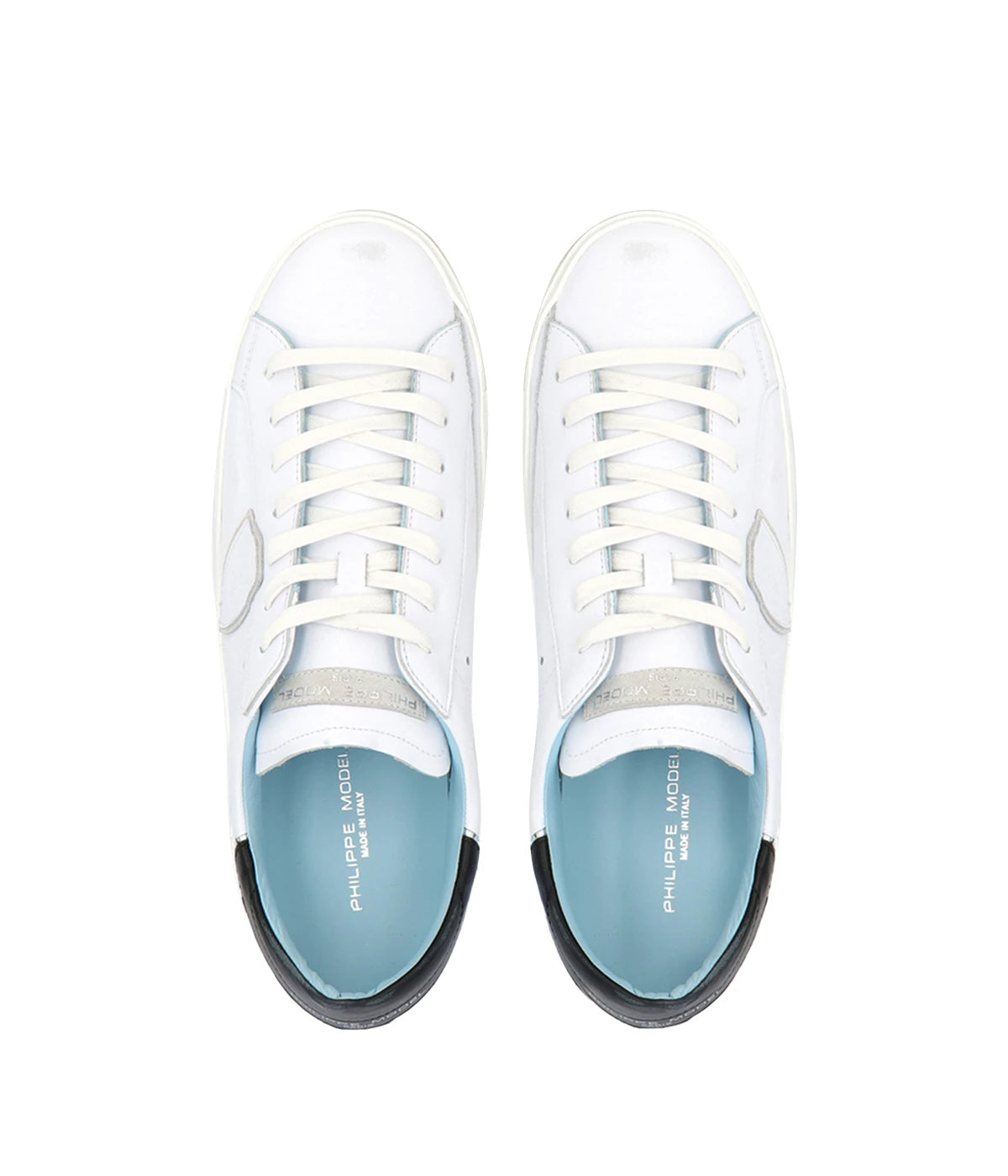 Top view of Philippe Model PRSX Low Man sneakers, highlighting the worn-effect white screen-printed laces and the vintage-used effect on the calfskin and suede upper. The 2.5 cm high brushed rubber sole with a vintage effect is visible.