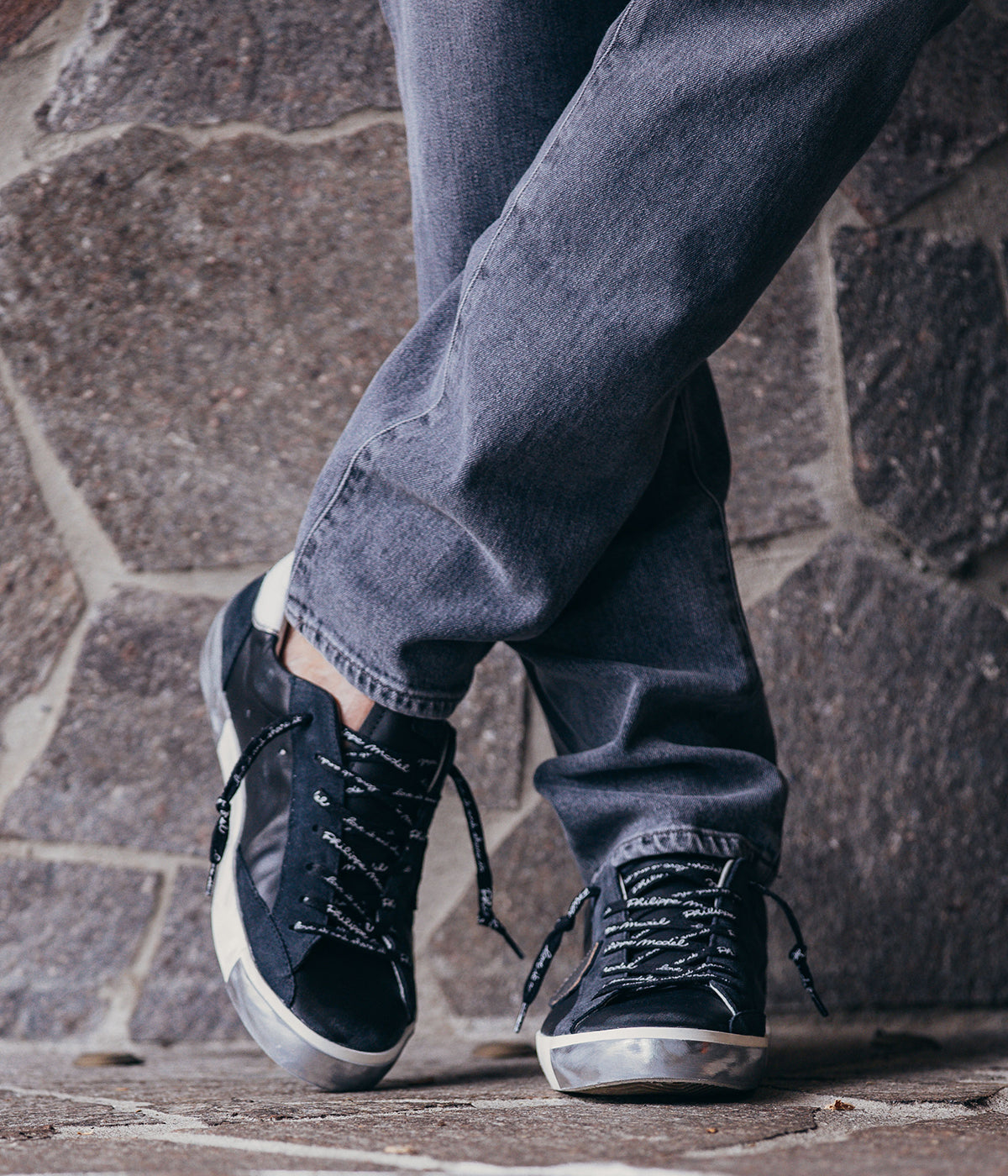 Philippe Model PRSX Low Man sneakers featuring a unique, vintage-effect design with a patented foxing tape creating an imperfect sole. Made from high-quality Italian calfskin and suede, the sneakers include laminated suede inserts and a worn, vintage-used effect. The shield on the side features the City of Paris coat of arms. White, screen-printed laces with a worn effect complement the brushed rubber sole, which is 2.5 cm high.