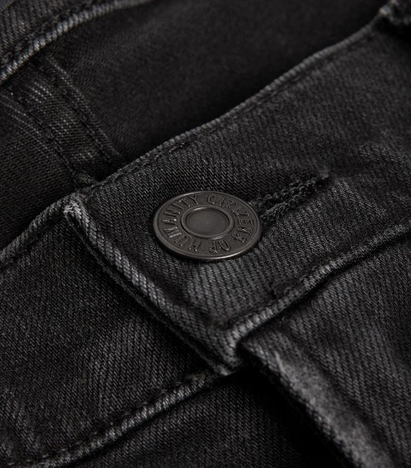 Close-up of the Perform denim texture, tonal stitching, and waistband, emphasising the premium craftsmanship.