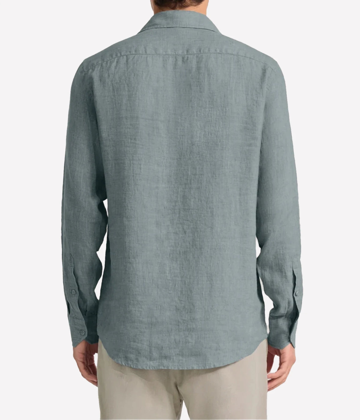 A man viewed from the back wearing a Frescobol Carioca Antonio Linen Long Sleeve Shirt in Ash Green, paired with light beige trousers, against a plain light grey background.