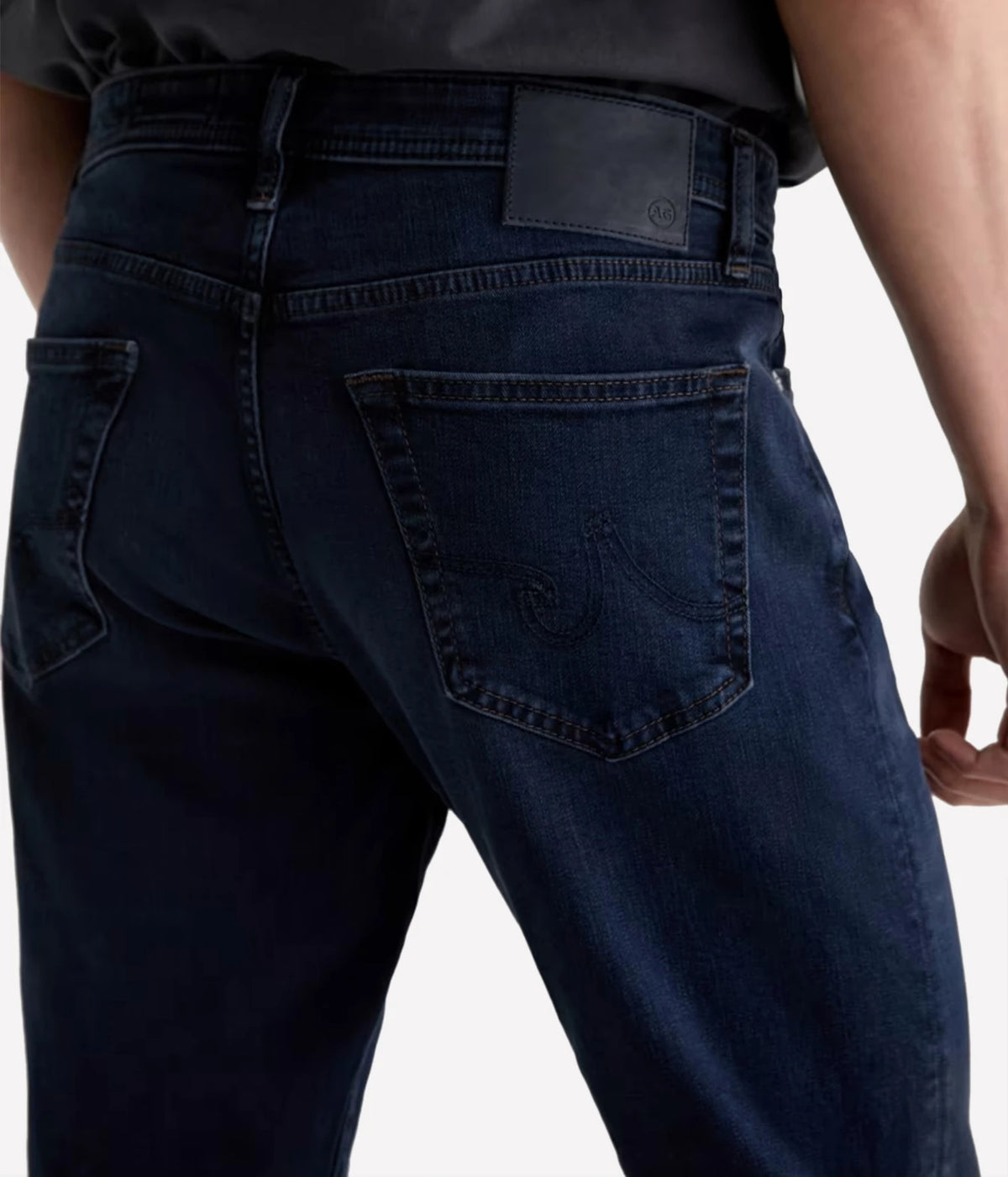 Close-up of AG Graduate Jean in Studio showing the back pockets and leather waistband patch