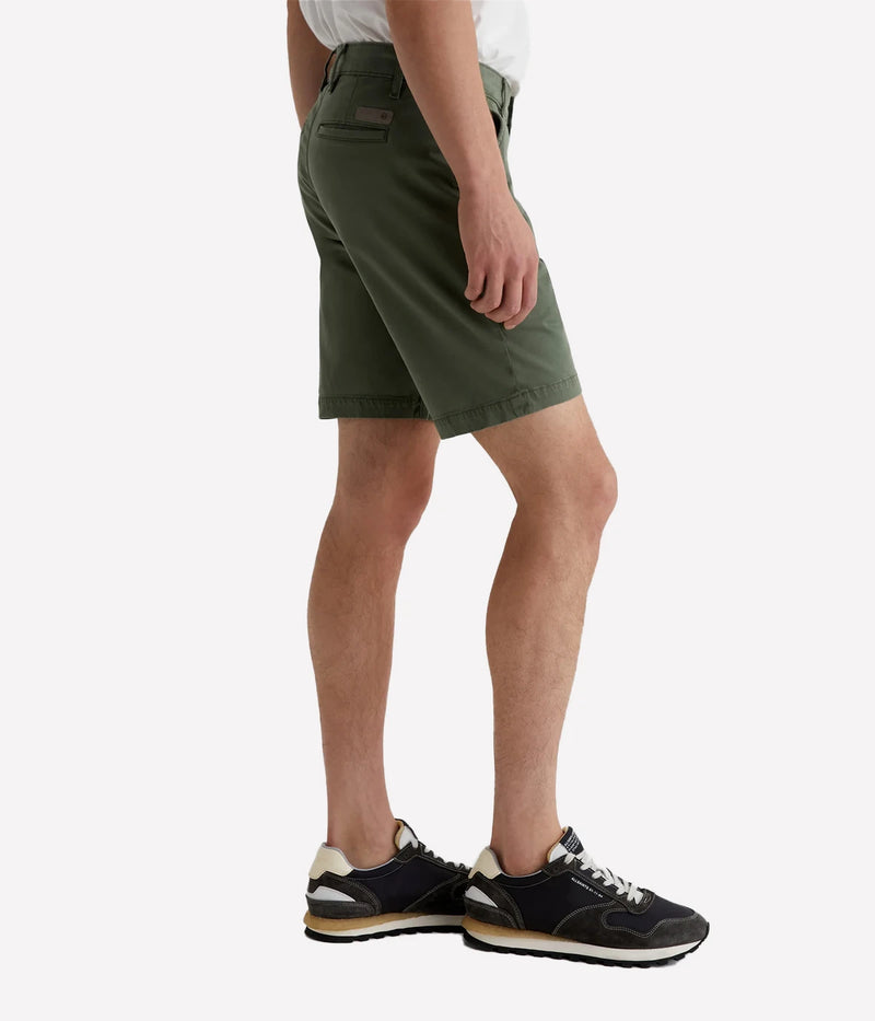 AG Wanderer Slim Fit Shorts in Sulfur Seaside Sage, featuring a sharp trouser look with a tapered leg opening. Made from ultra-lightweight cotton blend fabric for comfort. Material: 97.5% Cotton, 2.5% Elastane. Made in USA.