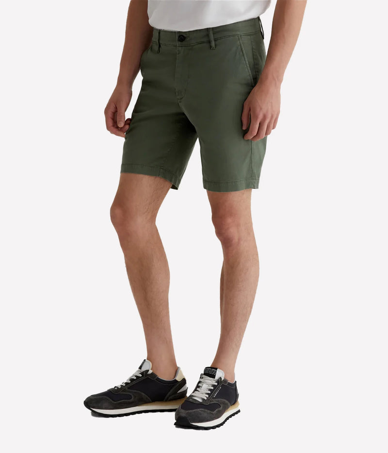AG Wanderer Slim Fit Shorts in Sulfur Seaside Sage, featuring a sharp trouser look with a tapered leg opening. Made from ultra-lightweight cotton blend fabric for comfort. Material: 97.5% Cotton, 2.5% Elastane. Made in USA.