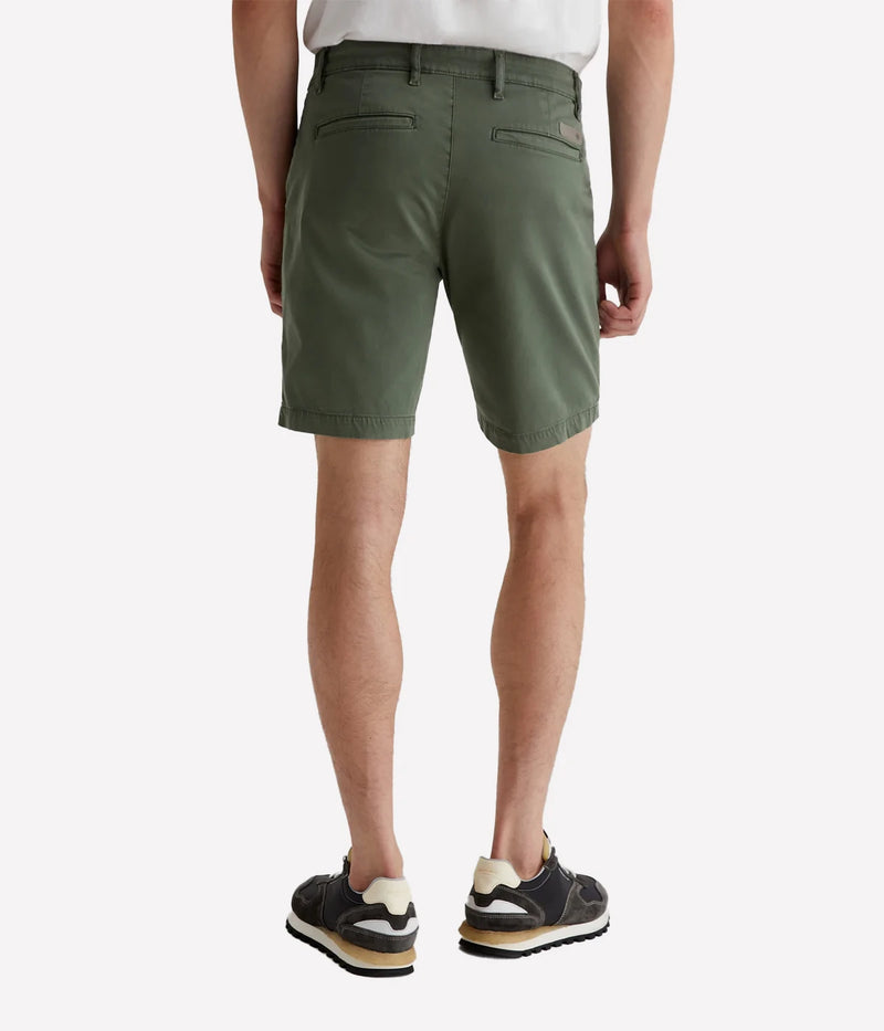 AG Wanderer Slim Fit Shorts in Sulfur Seaside Sage, featuring a sharp trouser look with a tapered leg opening. Made from ultra-lightweight cotton blend fabric for comfort. Material: 97.5% Cotton, 2.5% Elastane. Made in USA.