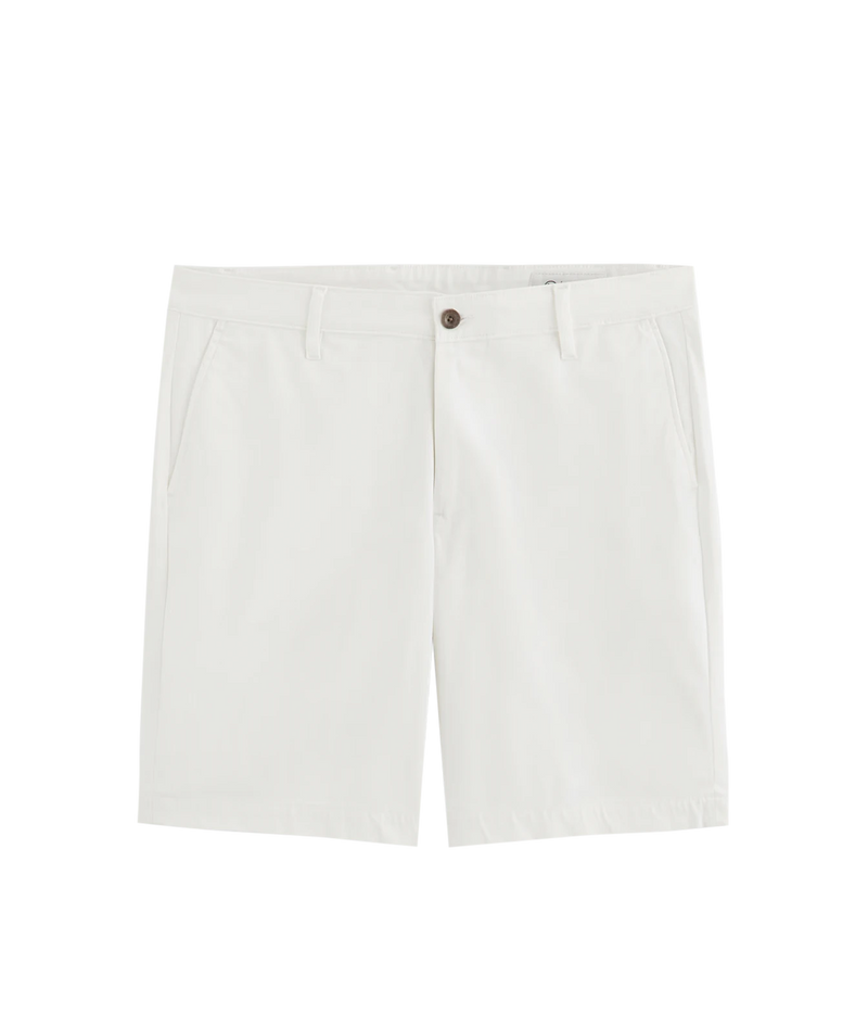A pair of off-white chino shorts with a brown button closure, displayed flat against a solid white background.
