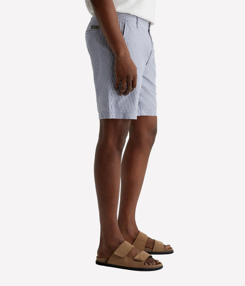 AG Wanderer Slim Fit Shorts in striped seersucker fabric, featuring a sharp trouser look with a tapered leg opening. Material: 100% Cotton. Made in USA.