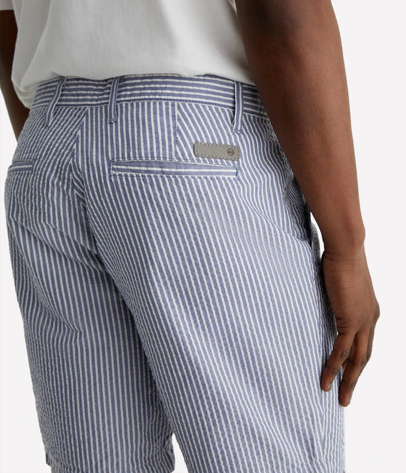 AG Wanderer Slim Fit Shorts in striped seersucker fabric, featuring a sharp trouser look with a tapered leg opening. Material: 100% Cotton. Made in USA.