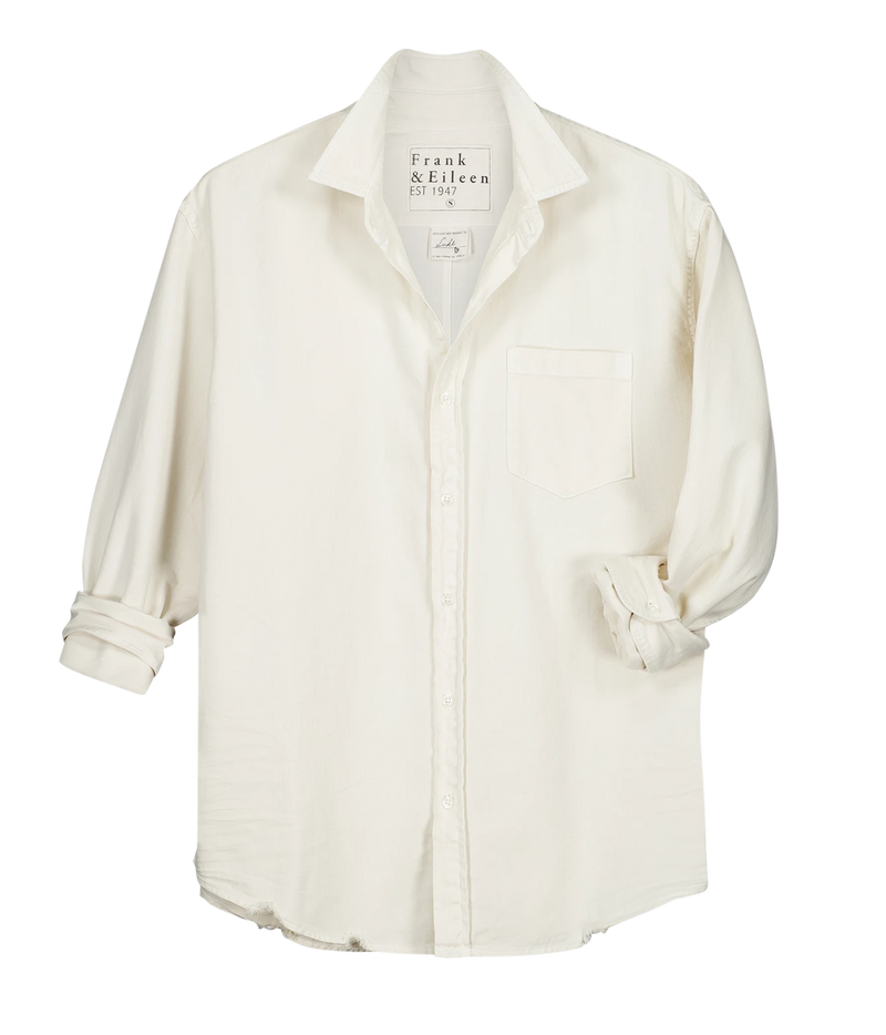 An off-white long-sleeve button-down shirt by Frank & Felicia, featuring a chest pocket and rolled cuffs, displayed flat against a white background.