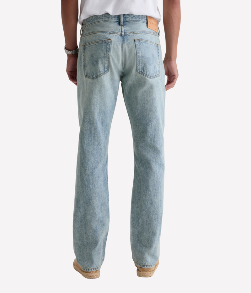 AG Everett Jean in 7 Years Sulfur Ashline worn on model - back view. 