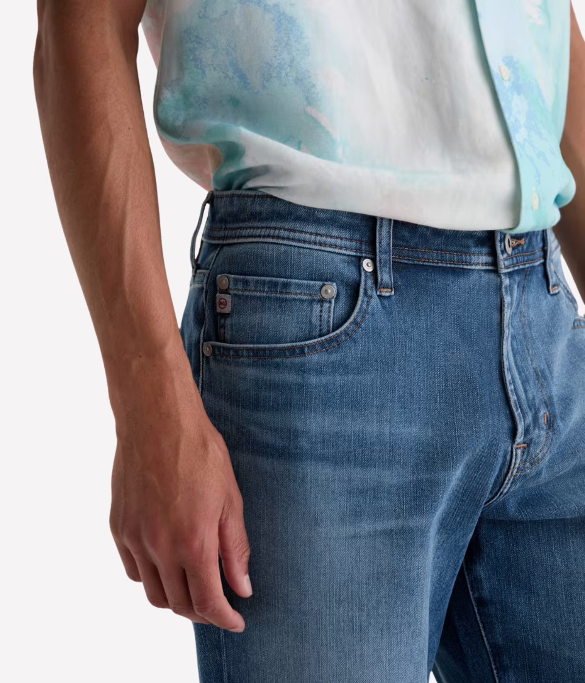 AG Reggie Jean in Northern Vine worn on model - close up waistband details. 