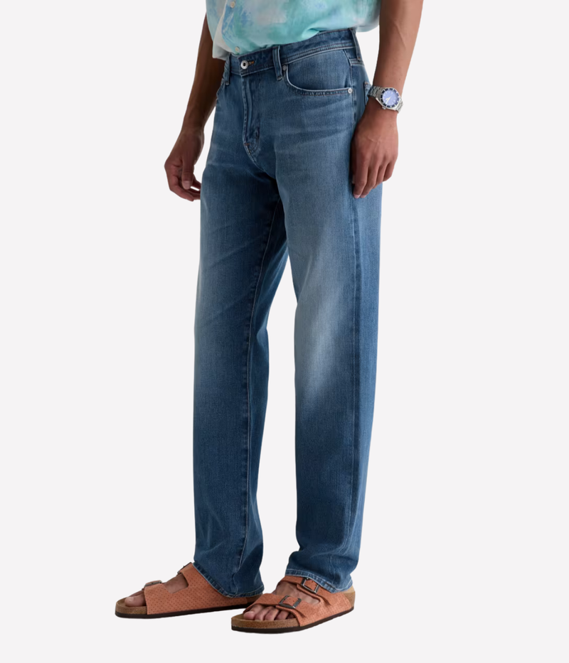 AG Reggie Jean in Northern Vine worn on model - angled side view.