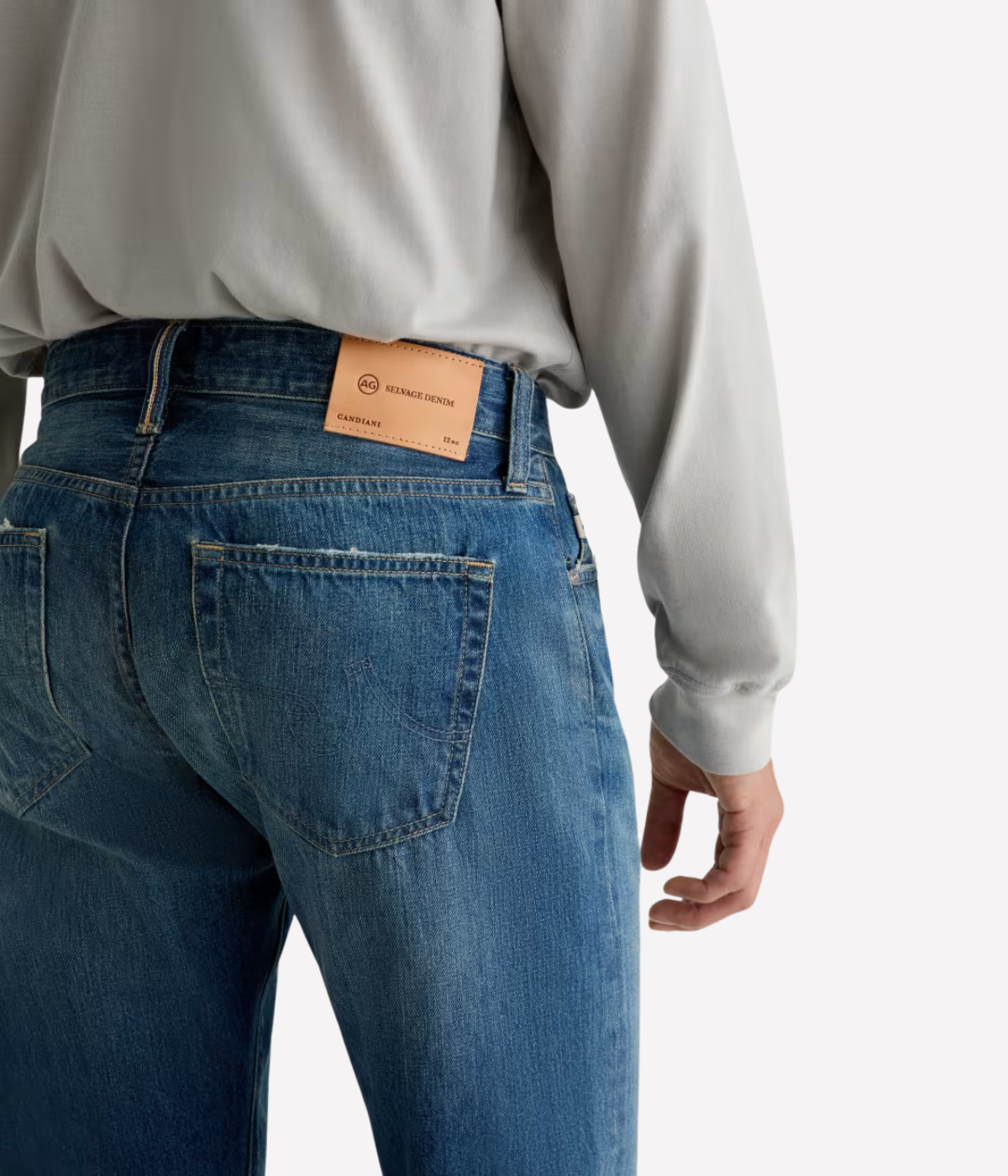 AG Tellis Jean in 15 Years Rafael worn on model - close up on back pocket. 