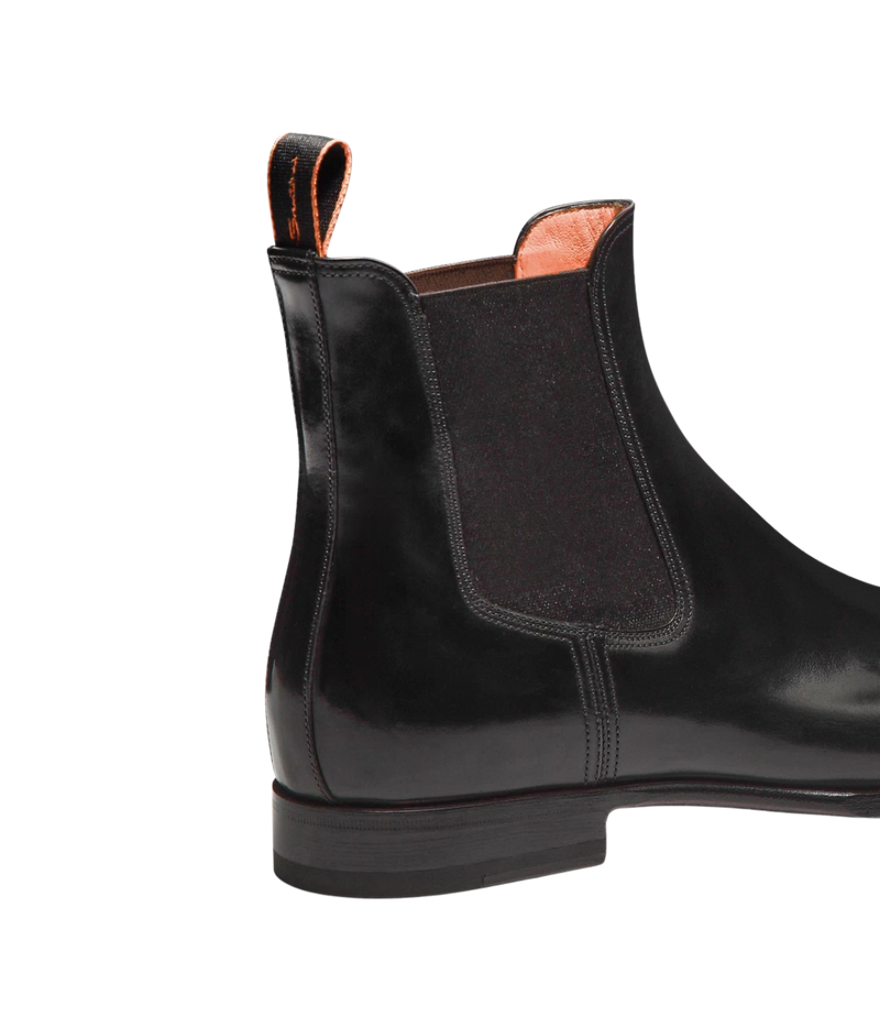 Santoni Archer Boot in Black close up on elasticated side insert and logo tape pull tab. 