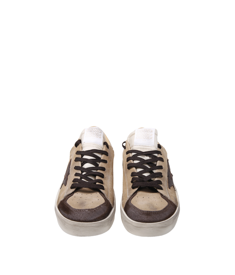 Golden Goose Stardan low-top sneakers in beige, brown and white with a suede upper, nylon tongue and leather star, front view.