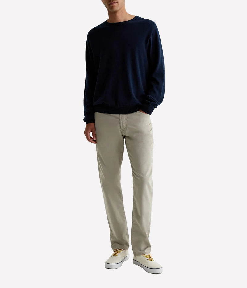 Everett Slim Straight Jeans, offering a relaxed yet refined fit with a slight taper at the leg. Crafted from lightweight, breathable Airluxe™ fabric and stretch-infused for comfort. Featuring five-pocket styling for a versatile look. Material: 53% Cotton, 44% Polyester, 3% Elastane. Made in USA.