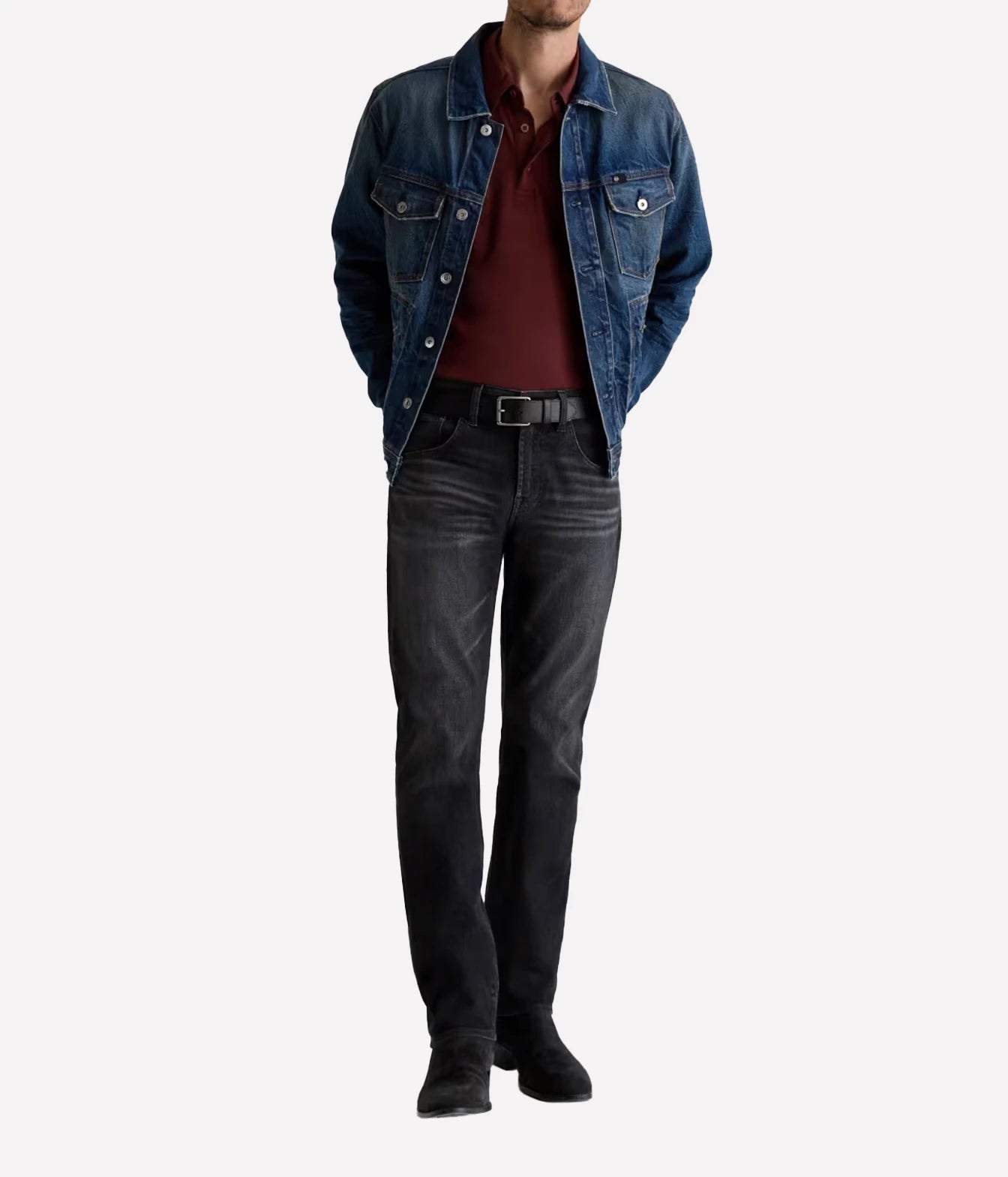A model wearing a blue denim jacket over a burgundy polo shirt, paired with dark gray jeans and black boots, shown against a plain light gray background.