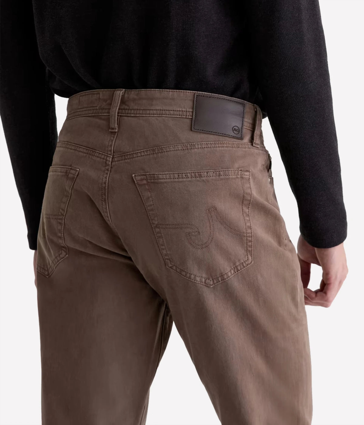 Close-up of AG Everett SUD Pant in Sulfur Taupe Grey showing the back pockets and leather waistband patch