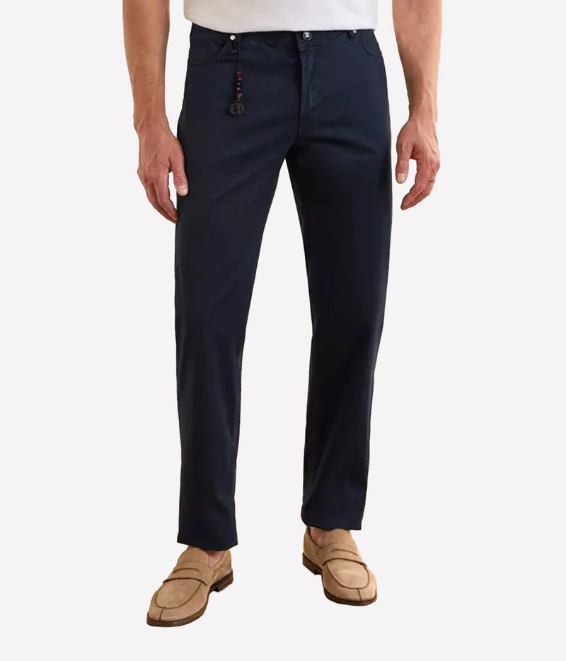 Man wearing Marco Pescarolo Neranom Cotton Five-Pocket Trouser in Navy with a white T-shirt and tan suede shoes, front view