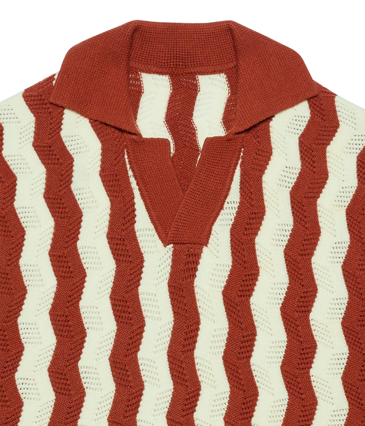 Close-up of a knit polo-style sweater with vertical wavy stripes in rust red and off-white, featuring a solid rust red collar and V-neck placket.
