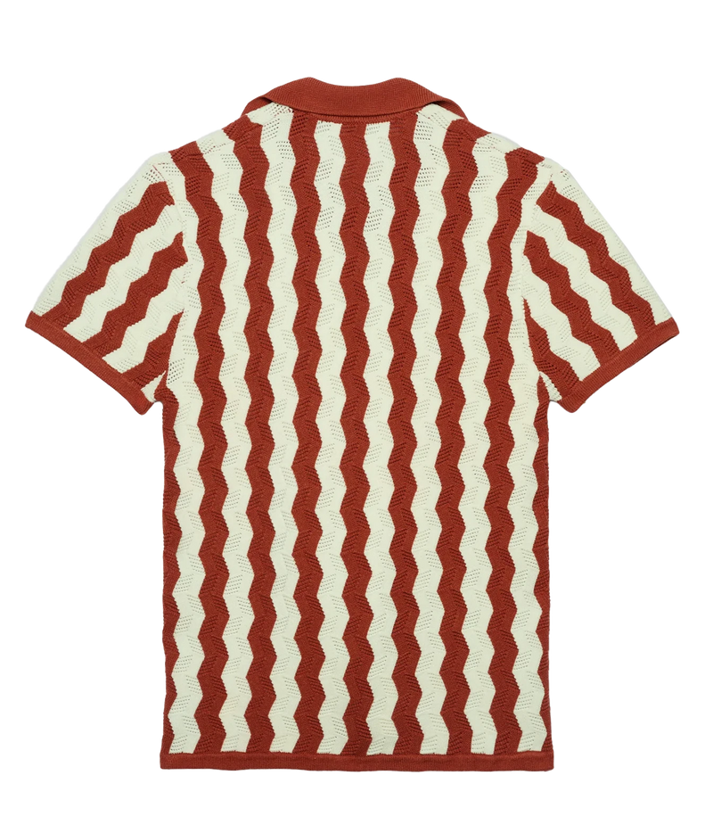 A short-sleeve knit polo shirt shown from the back, featuring a wavy vertical stripe pattern in rust red and cream.