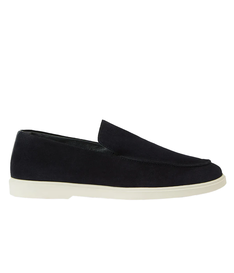 The Miguel Loafer in navy suede is a timeless summer essential, combining supple leather with effortless style. Designed for all-day comfort, it features a 100% recyclable thermoplastic rubber sole for durability and sustainability. A versatile warm-weather staple, perfect for pairing with linen trousers or tailored shorts.