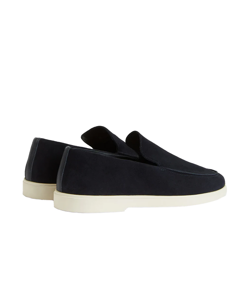The Miguel Loafer in navy suede is a timeless summer essential, combining supple leather with effortless style. Designed for all-day comfort, it features a 100% recyclable thermoplastic rubber sole for durability and sustainability. A versatile warm-weather staple, perfect for pairing with linen trousers or tailored shorts.