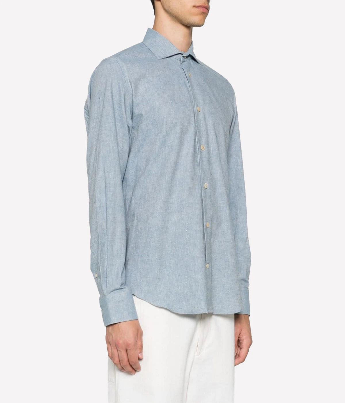 Dandy Shirt featuring a cutaway collar, front button fastening, and long sleeves with buttoned cuffs. Designed with a rear curved hem, this 100% cotton shirt blends refined style with relaxed elegance, perfect for smart-casual wear.