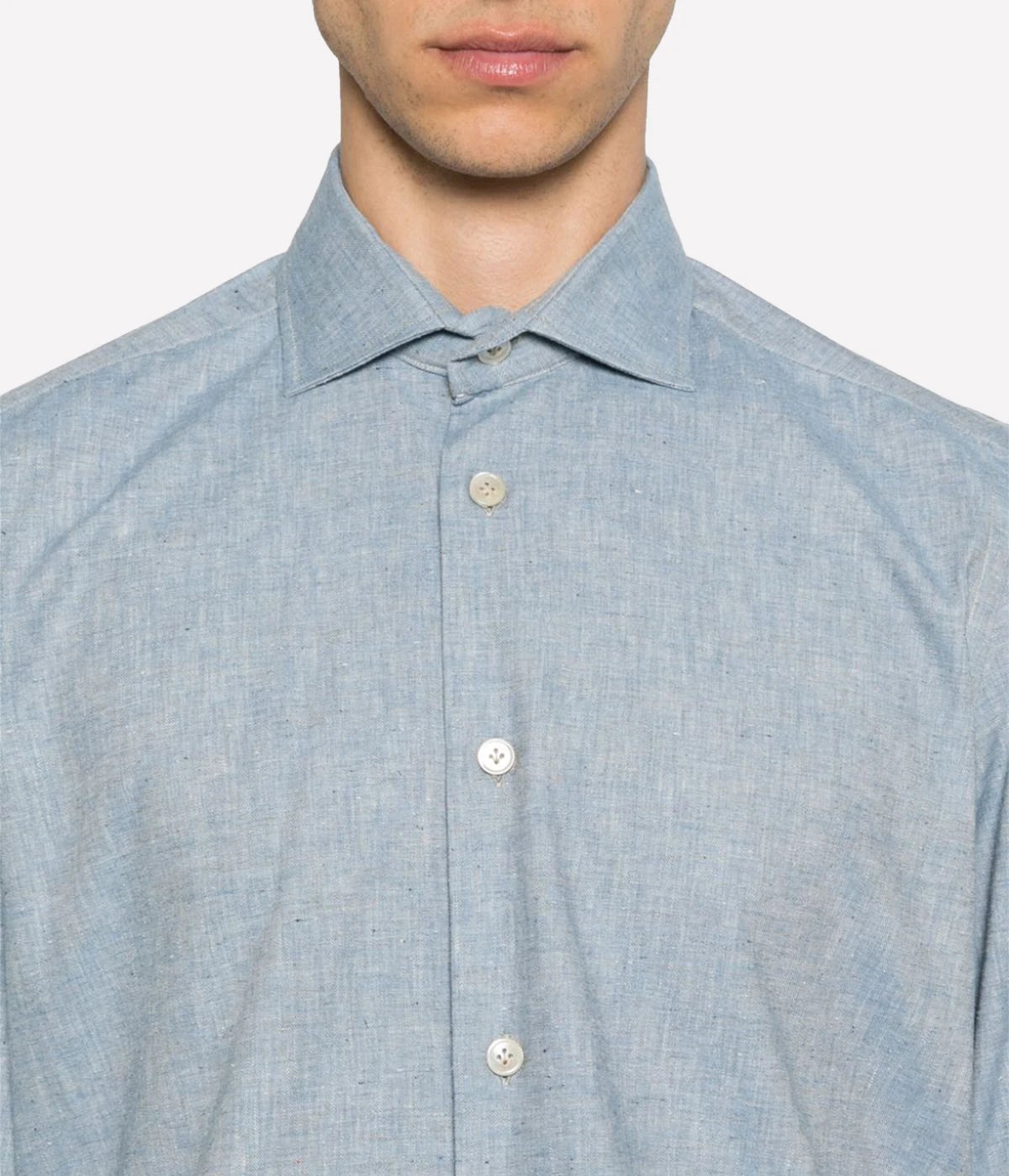 Dandy Shirt featuring a cutaway collar, front button fastening, and long sleeves with buttoned cuffs. Designed with a rear curved hem, this 100% cotton shirt blends refined style with relaxed elegance, perfect for smart-casual wear.