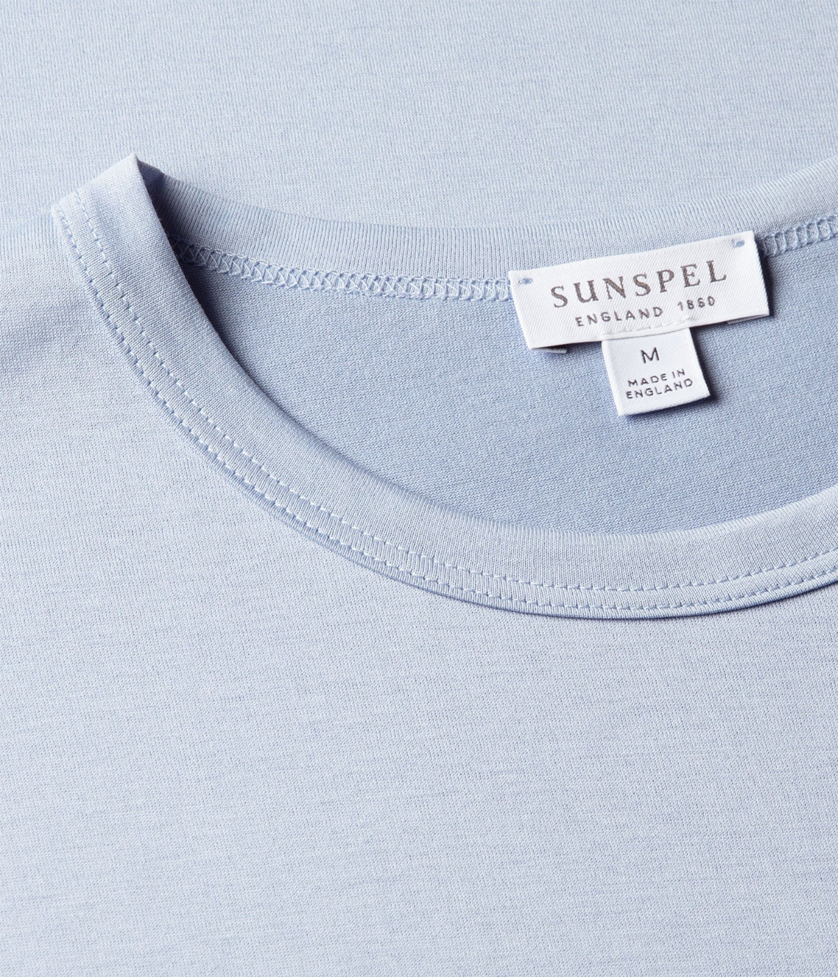 Sunspel Short Sleeve Crew Neck T-Shirt in Sky flat lay close-up of crew neckline detailing and soft Supima cotton fabric.