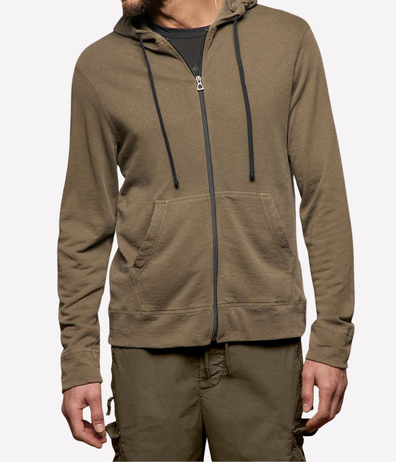James Perse Vintage French Terry Zip Hoodie in Light Olive Pigment – upper body view on model highlighting zip-front closure, drawcord hood, and patch pocket detailing.