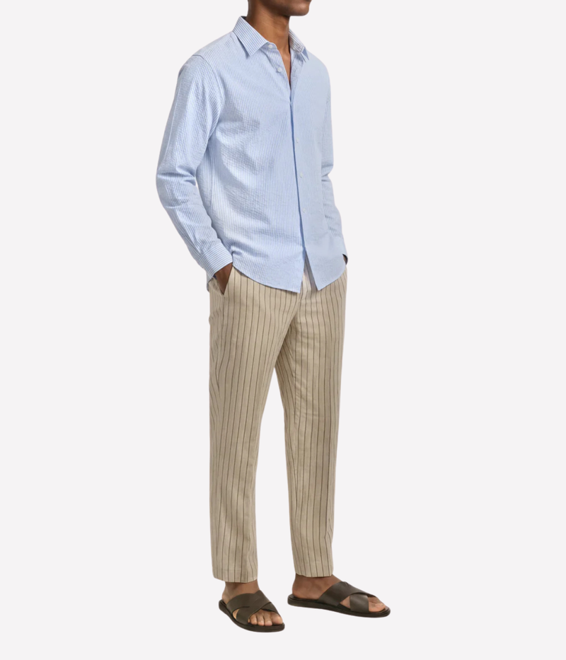 Orlebar Brown Justin Seersucker Stripe Shirt in Surfside Blue & Thasos Beach angled front view on model