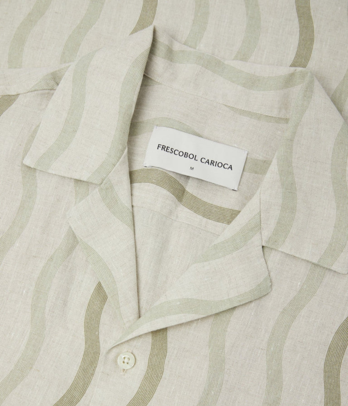 Frescobol Carioca Roberto Linen Short Sleeve Shirt in Palm Green featuring an all-over Cabana Pinstripe print, camp collar and relaxed fit - Closeup Shot on Collar
