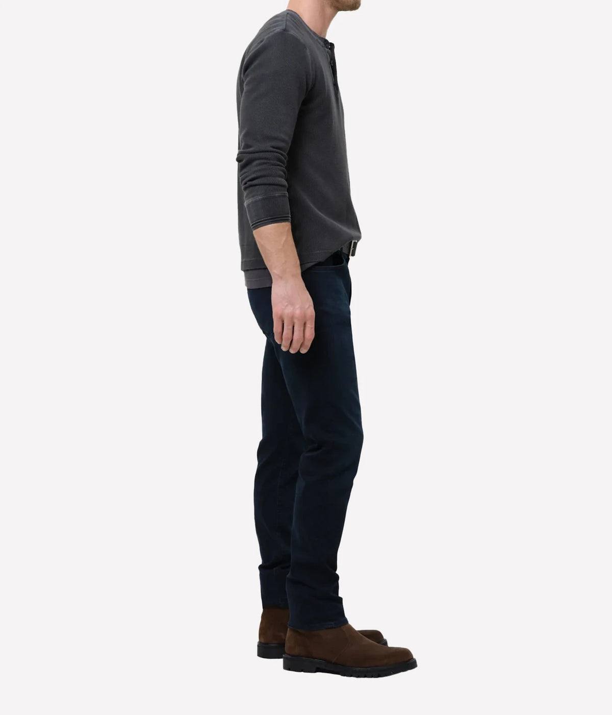 Man wearing Citizens of Humanity London Tapered Slim Perform Jean in Hyde, side view.