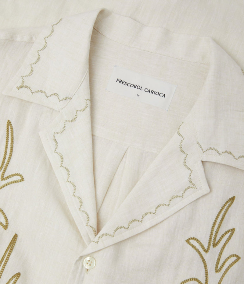 Frescobol Carioca Alves Palm Embroidered Linen Short Sleeve Shirt in Cream featuring seasonal palm embroidery, a camp collar and chest pocket - Closeup View on Collar