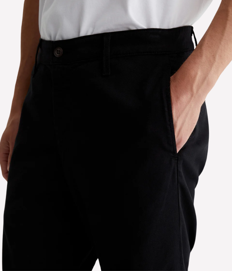 A versatile slim-fit trouser designed for modern men who appreciate style and comfort. Crafted from premium Sorrento Stretch Twill, these black trousers offer a tailored look with flexibility, making them perfect for both casual and elevated occasions.
