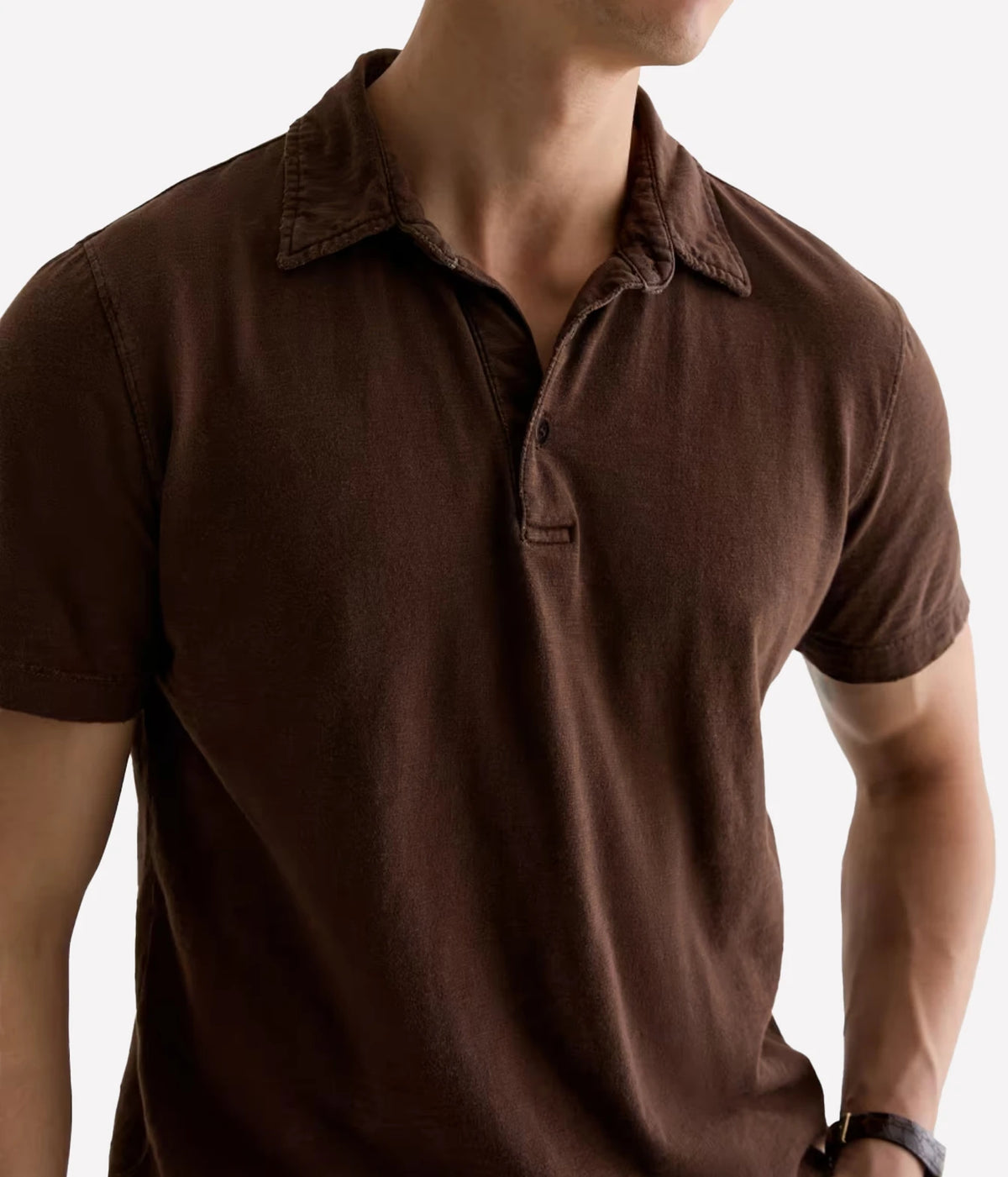 Close-up of AG Bryce Short Sleeve Polo in Sulfur Wood Brown showing the self-collar and button placket