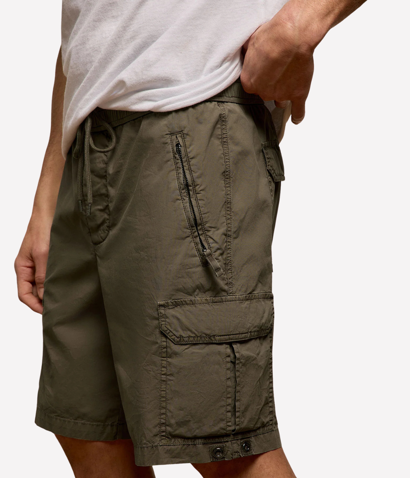 James Perse Supima Poplin Cargo Shirt in Light Olive Pigment – lower body view on model highlighting cargo pocket detailing, utility-inspired design, and lightweight stretch poplin fabric.