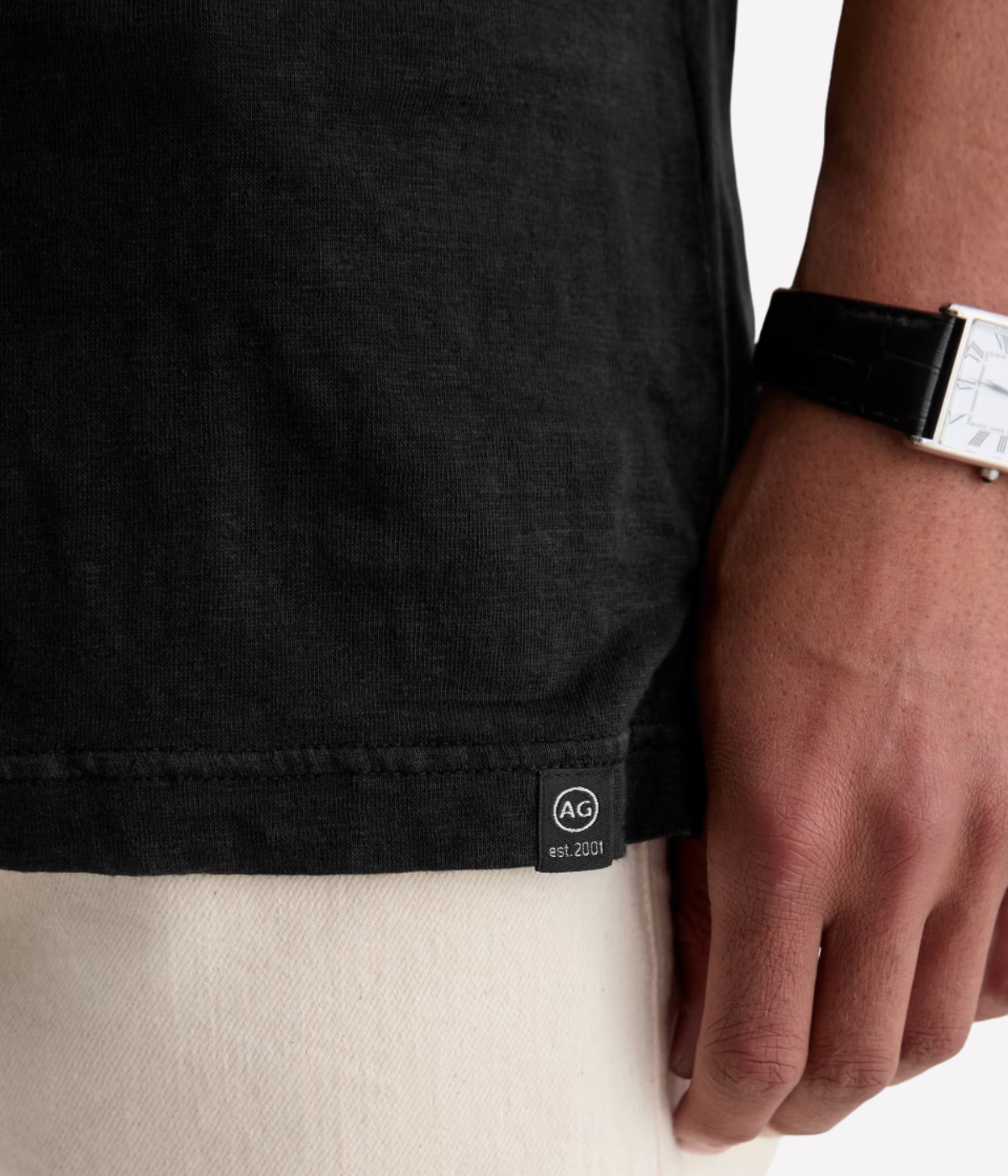 AG Bryce Short Sleeve Polo in True Black close up on logo labelling. 