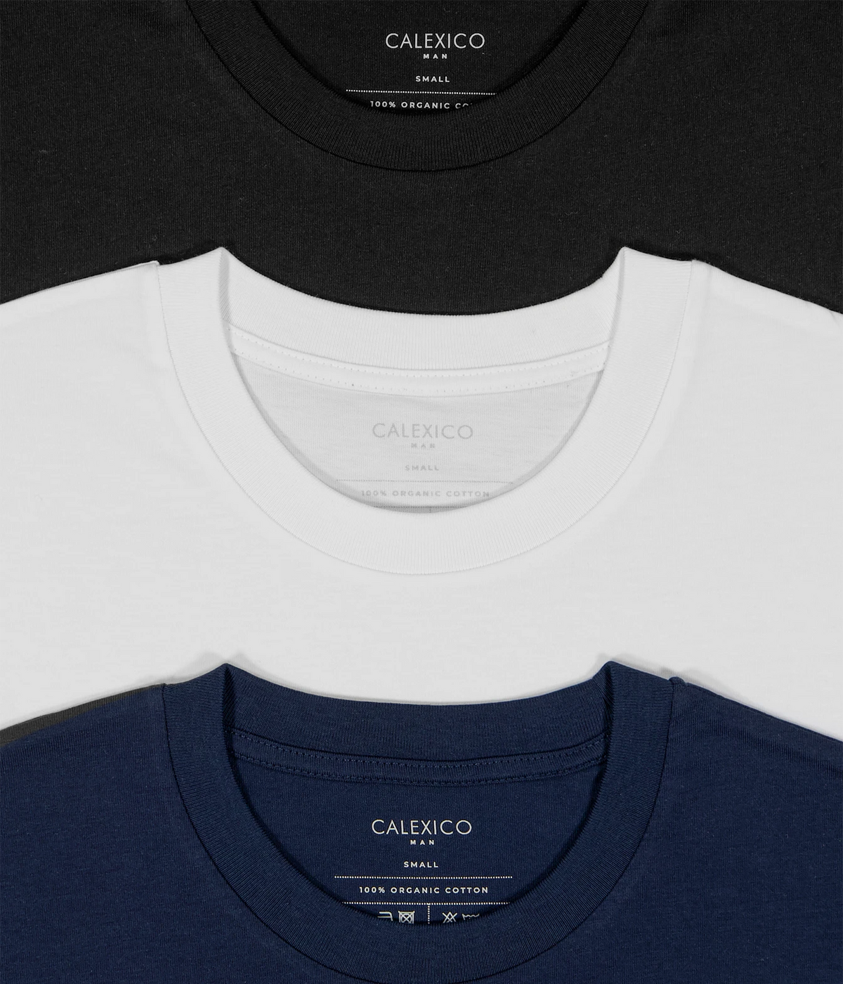 Three crewneck t-shirts from Calexico are arranged in a stacked layout, showing the inner neck labels. The top shirt is black, the middle is white, and the bottom is navy blue.